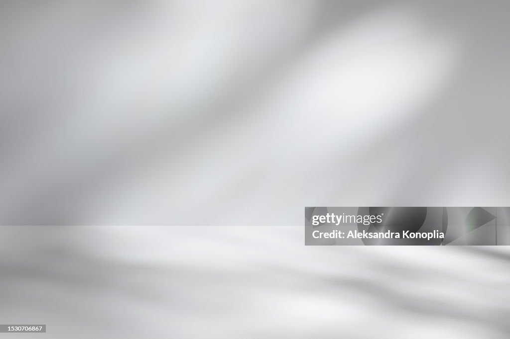 Empty studio room background with abstract diagonal window light and shadows. Minimal 3d monochrome architectural stage with dreamy soft light. Front view, copy space