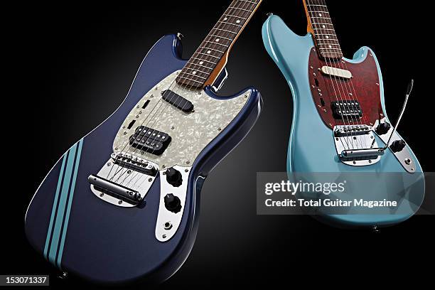 Pair of Fender Kurt Cobain Mustang electric guitars in Dark Lake Placid Blue and Sonic Blue finishes, photographed during a studio shoot for Total...