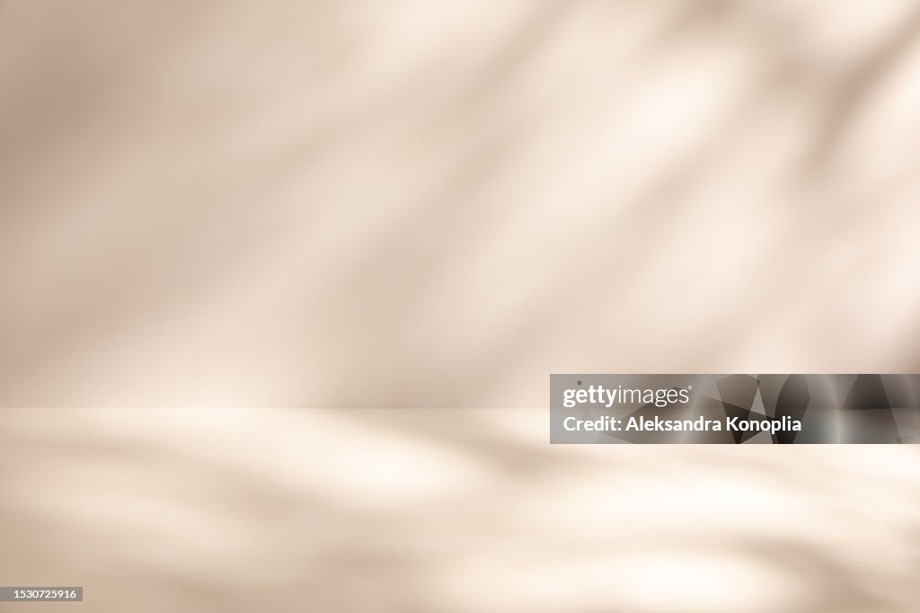 Empty Studio 3d exhibition background - pastel creamy pink beige stage with soft natural abstract diagonal window light and shadows.