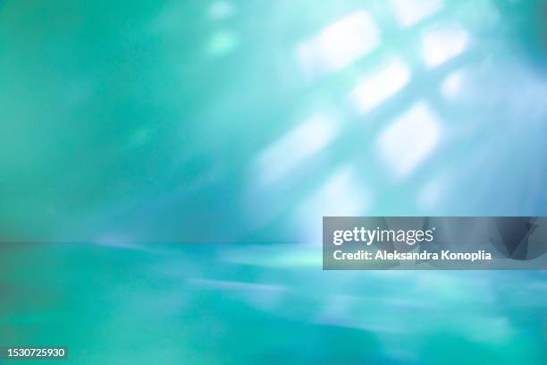 empty studio 3d exhibition background - emerald green, turquoise, mint, blue stage with with abstract diagonal  light and shadows, crystal caustics effect. dreamy surreal backdrop - エメラルドグリーン 風景 ストックフォトと画像
