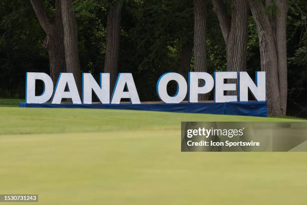 The Dana Open signage is seen in the background on the 18th green during the first round of the LPGA Dana Open on July 13, 2023 at Highland Meadows...