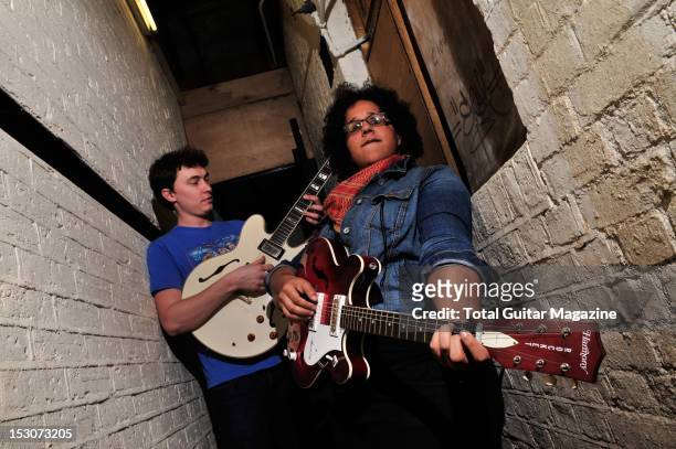Guitarists Heath Fogg and Brittany Howard of blues rock band Alabama Shakes, backstage at the Boston Arms on February 24, 2012 in London.