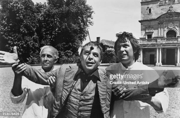 Czech-born actor Herbert Lom as the deranged Dreyfus, being restrained by two asylum orderlies in the film 'The Pink Panther Strikes Again', 1976.