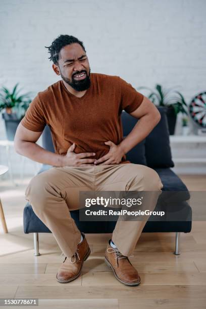 man with abdominal pain - human intestine stock pictures, royalty-free photos & images