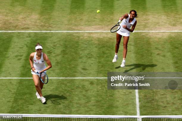 Naiktha Bains of Great Britain and Maia Lumsden of Great Britain serve against Viktoria Hruncakova of Slovakia and Tereza Mihalikova of Slovakia in...