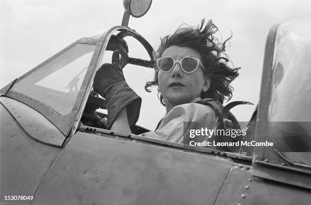 Jackie Moggridge , a ferry pilot of the ATA in the cockpit of a Supermarine Spitfire fighter, September 1944. ATA pilots deliver newly manufactured...
