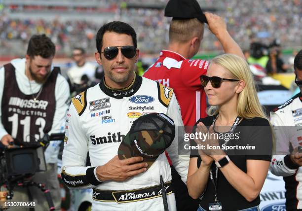 Aric Almirola and his wife Janice look on prior to the running of the NASCAR Cup Series Quaker State 400 on July 09 at Atlanta Motor Speedway in...