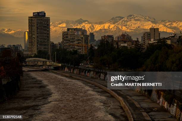 View of the Andes during sunset in Santiago on July 13, 2023.