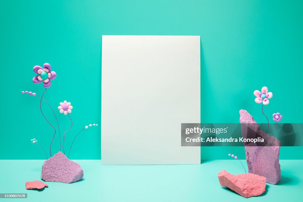 Abstract 3d stage with blank A4 white paper sheet or white promotion poster mockup and fun kawaii flowers and pastel colored rocks on green mint, turquoise background with copy space.