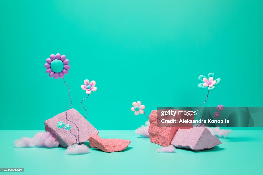 Abstract 3d stage with cute kawaii flowers, pink cotton candy and empty pastel purple and coral colored rocks podiums on green mint, turquoise, pink solid background with copy space