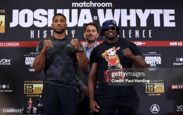 Anthony Joshua, promoter Eddie Hearn and Dillian Whyte pose during the Anthony Joshua v Dillian Whyte 2 Press Conference at Hilton London Syon Park...