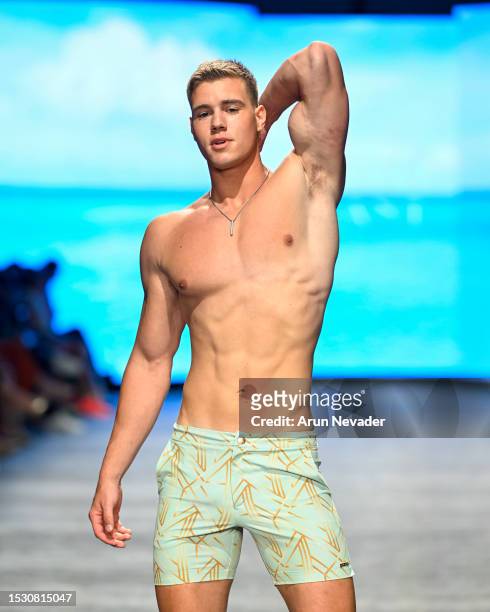 Model walks the runway wearing Argyle Grant during Miami Swim Week Powered by Art Hearts Fashion at Fontainebleau Hotel on July 09, 2023 in Miami...