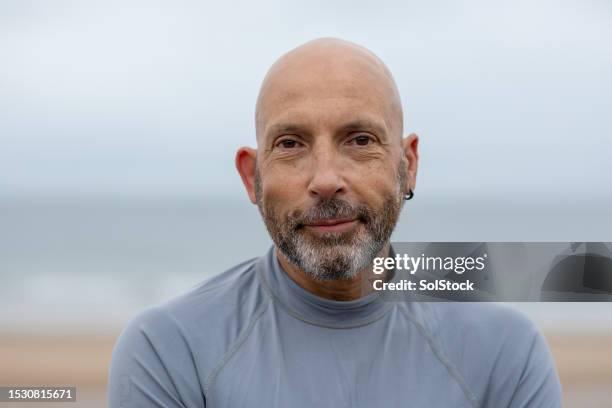 the face of a surfer - stubble stock pictures, royalty-free photos & images