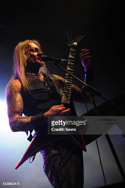 guitarrist and vocalist of metal band at club concert - heavy metal stock pictures, royalty-free photos & images