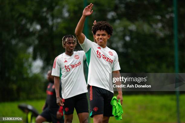 Noam Emeran, Shola Shoretire of Manchester United in action during a first team training session at Carrington Training Ground on July 10, 2023 in...