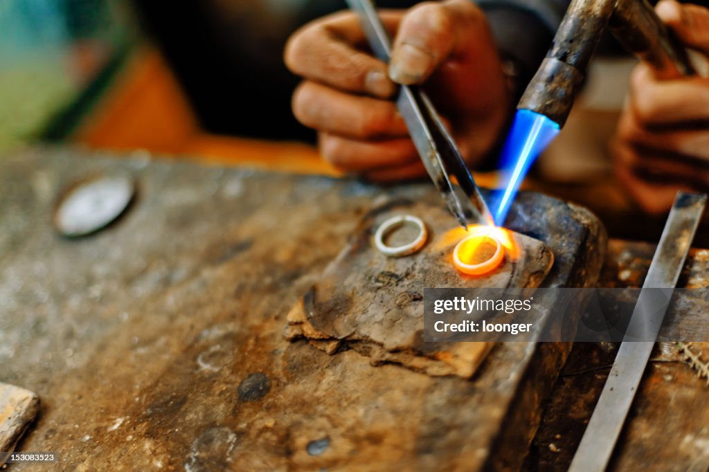 Welding torch melting the silver rings