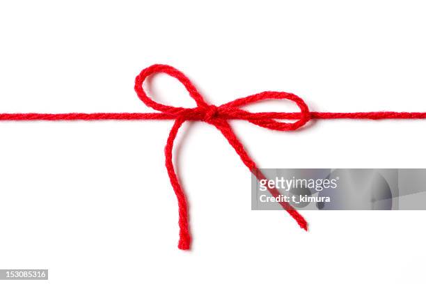 red ribbon - knots stock pictures, royalty-free photos & images