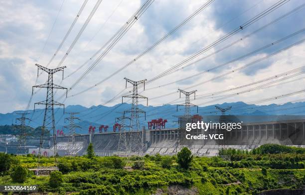 Transmission towers stand in front of the Three Gorges Dam on the Yangtze River on July 10, 2023 in Yichang, Hubei Province of China.