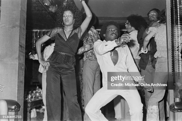 Soul Train dancers dance at a club. The pictures feature in the "Right On!" Magazine, United States, 1st October 1975.