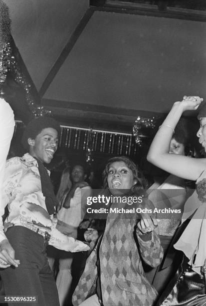 Soul Train dancers dance at a club. The pictures feature in the "Right On!" Magazine, United States, 1st October 1975.