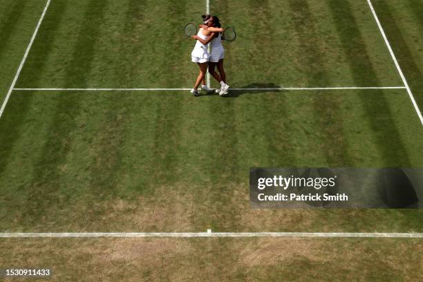 Naiktha Bains of Great Britain and Maia Lumsden of Great Britain celebrate winning match point against Viktoria Hruncakova of Slovakia and Tereza...