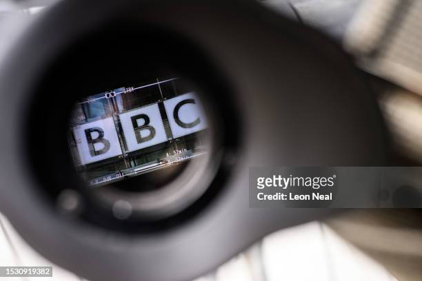The logo on the front of BBC Broadcasting House is seen through a televison camera viewfinder on July 10, 2023 in London, England. Last week, the Sun...