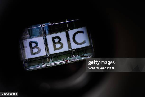 The logo on the front of BBC Broadcasting House is seen through a televison camera viewfinder on July 10, 2023 in London, England. Last week, the Sun...