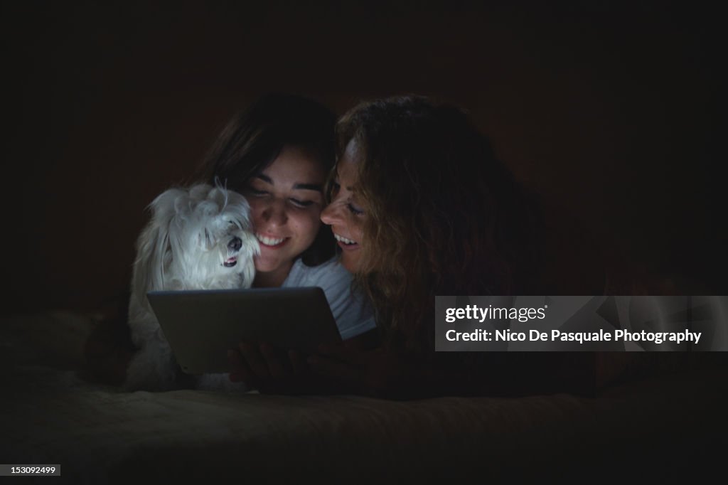 Mother and daughter with puppy