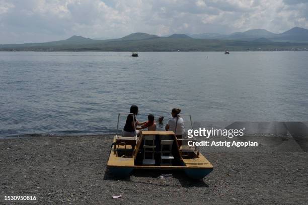 Lake Sevan attracts tourists who come to ride small boats on July 9, 2023 in Sevan, Armenia. Armenia's iconic lake is shrinking due to low...