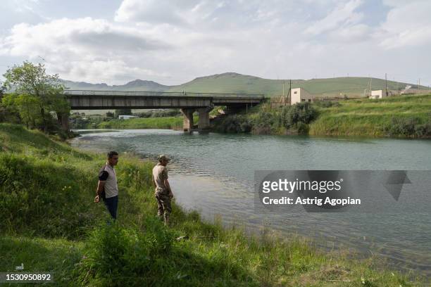 Local fishermen near the river Hrazdan, which flows from Lake Sevan, which is currently very polluted from the sewage and is used heavily by...