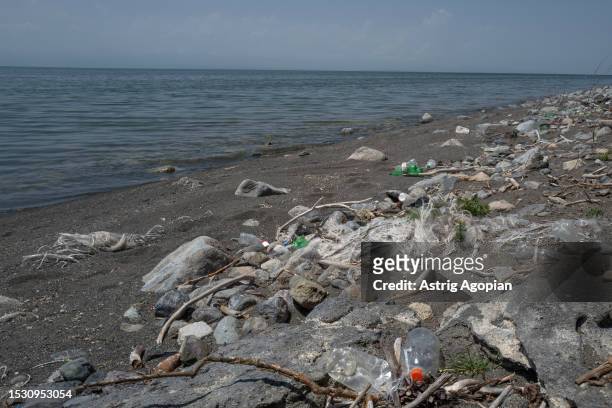 Bank of Lake Sevan completely polluted by abandoned fish nets, plastic bottles and other waste on July 8, 2023 in Tsapatagh, Armenia. Armenia's...