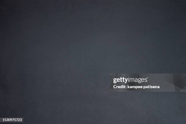 textured simplicity: black cardboard paper close-up background - newspaper texture stock pictures, royalty-free photos & images