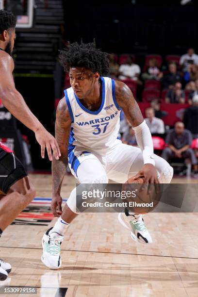 Kendric Davis of the Golden State Warriors dribbles the ball during the game against the Houston Rockets during the 2023 NBA Las Vegas Summer League...