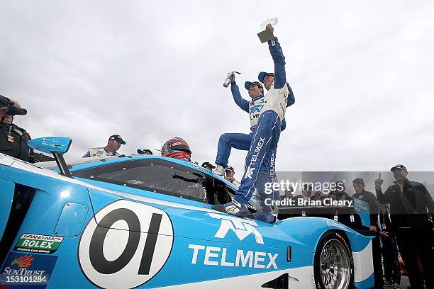 Memo Rojas and Scott Pruett celebrate after winning the 2012 Grand-Am Rolex Series Championship at Lime Rock Park on September 29, 2012 in Lakeville,...