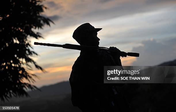 Myanmar-unrest-minorities,FOCUS' by Soe Than Win This picture taken on September 22, 2012 shows a soldier from the All Burma Students Democratic...