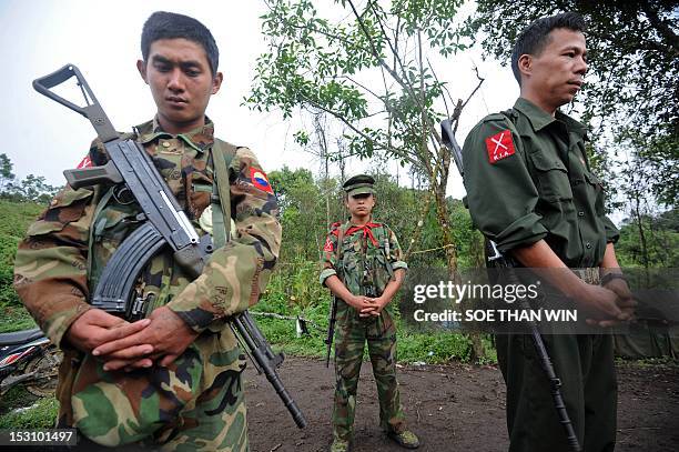 Myanmar-unrest-minorities,FOCUS' by Soe Than Win This picture taken on September 19, 2012 shows Kachin Independence Army soldiers praying before...