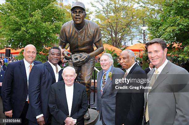 Former Oriole Brooks Robinson poses for photos with former Orioles Cal Ripken Jr., Eddie Murray, Earl Weaver, Frank Robinson and Jim Palmer at a...