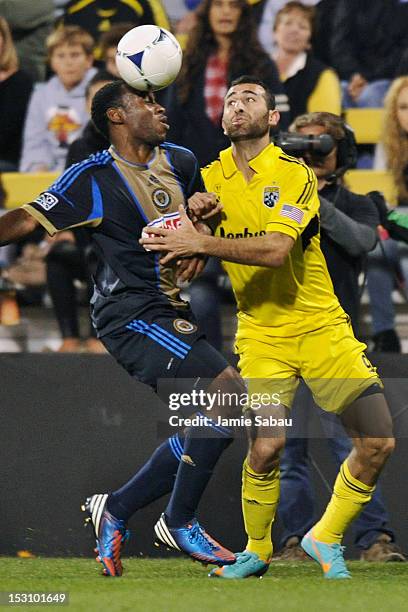 Amobi Okugo of the Philadelphia Union takes control of a loose ball as Justin Meram of the Columbus Crew defends in the second half on September 29,...