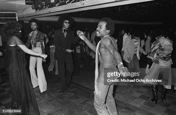 Soul Train dancers dance at an entertainment club. The pictures were placed in the "Right On!" magazine, United States, 10th December 1976.