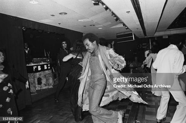 Soul Train dancers dance at an entertainment club. The pictures were placed in the "Right On!" magazine, United States, 10th December 1976.