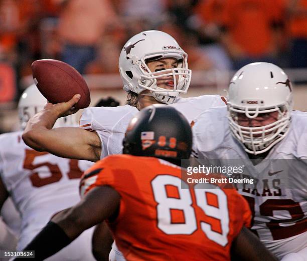 Quarterback David Ash of the Texas Longhorns looks to throw against the Oklahoma State Cowboys on September 29, 2012 at Boone Pickens Stadium in...