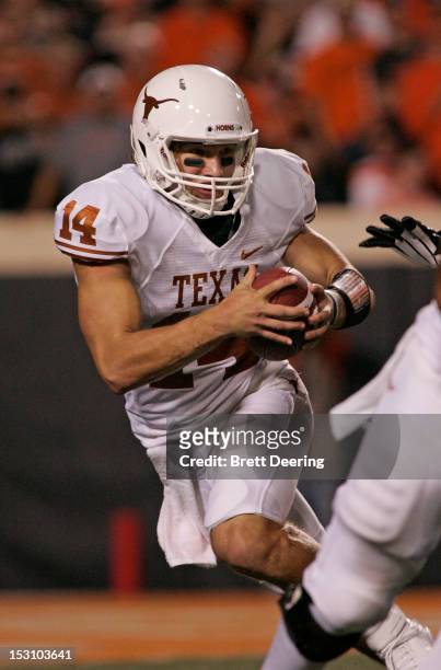 Quarterback David Ash of the Texas Longhorns scrambles against the Oklahoma State Cowboys on September 29, 2012 at Boone Pickens Stadium in...
