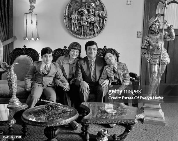 Portrait of married couple Carmen Gomez and realtor Fausto Gomez , with their sons, Roy and Rodney, New York, New York, 1975.