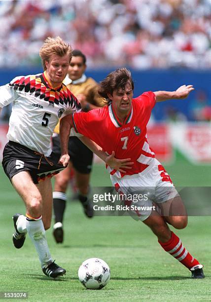 S JERSEYS WHILE BATTLING FOR POSSESION OF THE BALL DURING BULGARIA's 2-1 VICTOREY OVER GERMANY IN THE QUARTER FINALS OF THE 1994 WORLD CUP AT GIANTS...