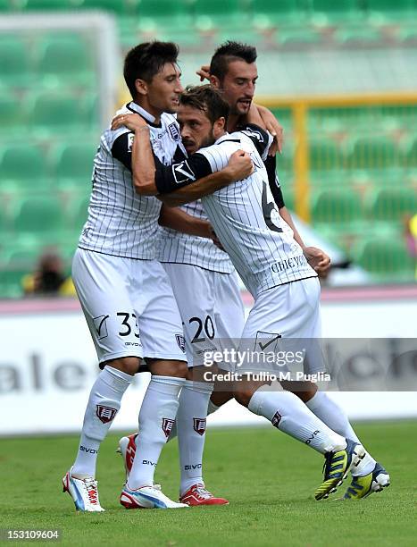 Marco Rigoni of Chievo Verona celebrates with team-mates after scoring the equalizing goal celebrates after scoring the opening goal during the Serie...