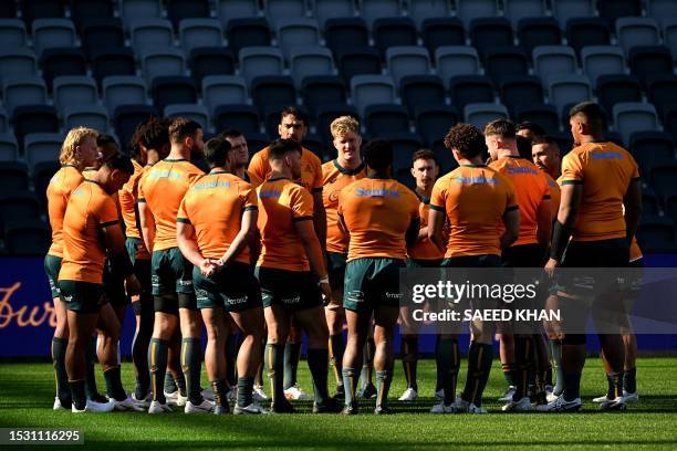 Australia's rugby players prepare for a training session in Sydney on July 14 ahead of their Rugby Championship match against Argentina. / -- IMAGE...