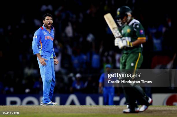 Indian player Yuvraj Singh celebrates the dismissal of Pakistani player Kamran Akmal during the ICC T20 World Cup, Super Eight group 2 cricket match...