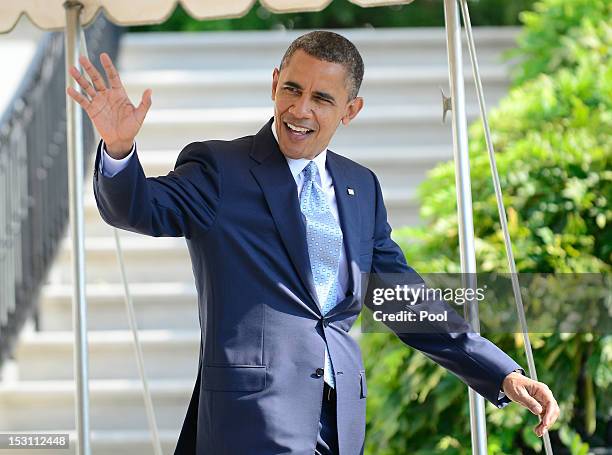 President Barack Obama waves as he walks to Marine One on the South Lawn to depart the White House September 30, 2012 in Washington, DC. Obama is...