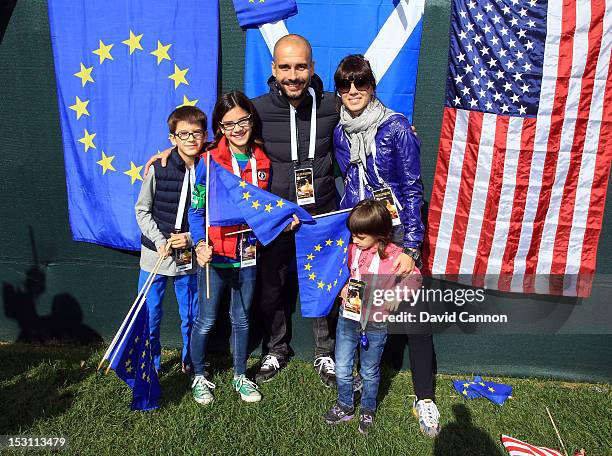 Former Barcelona football team manager Pep Guardiola and wife Cristina Serra pose with their family before the Singles Matches for The 39th Ryder Cup...