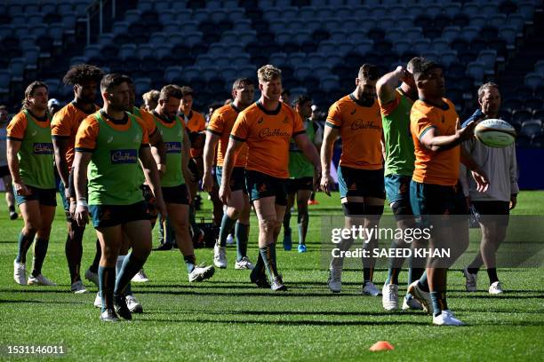 Australia's players attend a training session in Sydney on July 14 ahead of their Rugby Championship match against Argentina. / -- IMAGE RESTRICTED...